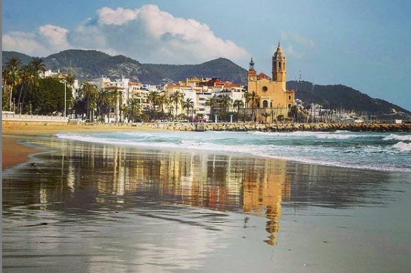 Reflection of Sitges in the water
