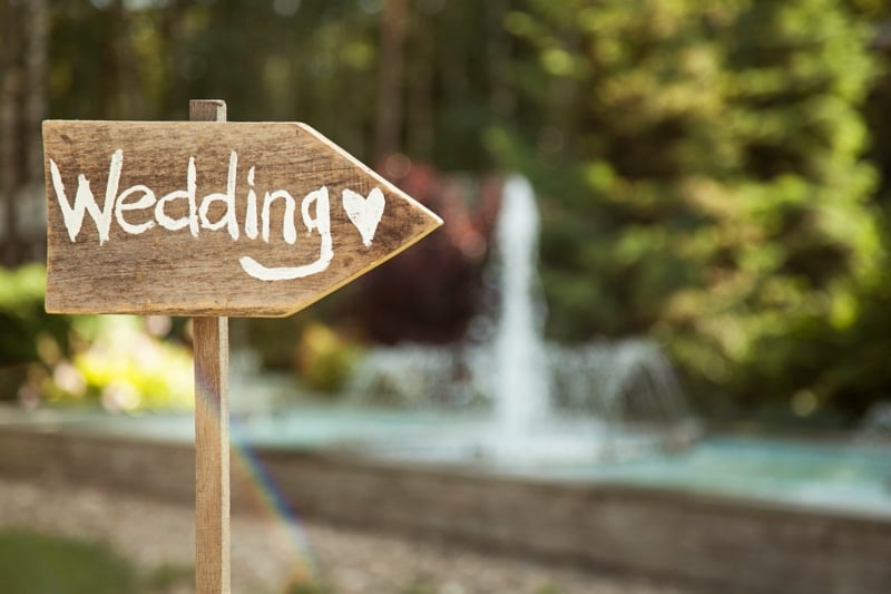 Sign pointing to a wedding
