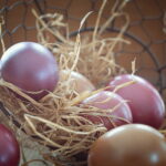 Pink and brown Easter Eggs in a basket