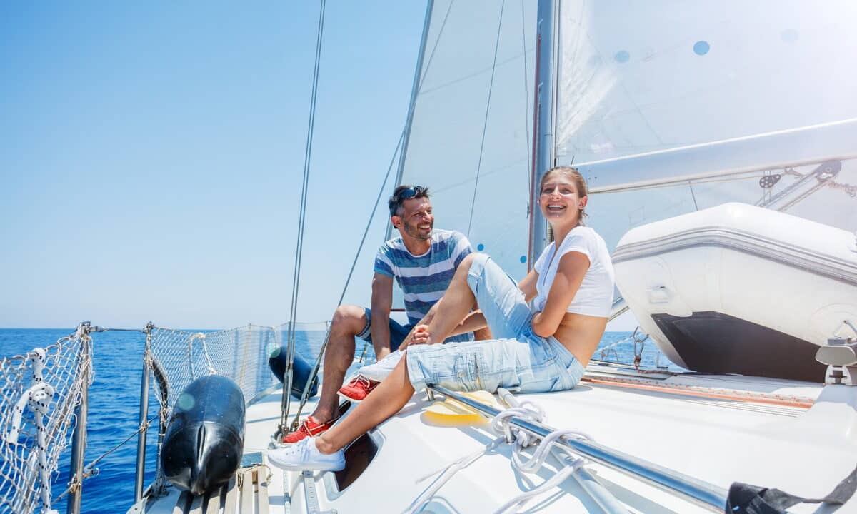 A man and his teenage daughter on a yacht off Sitges